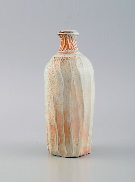 Danish studio ceramicist. Unique vase in glazed stoneware. Beautiful glaze in light and orange shades. Late 20th century.