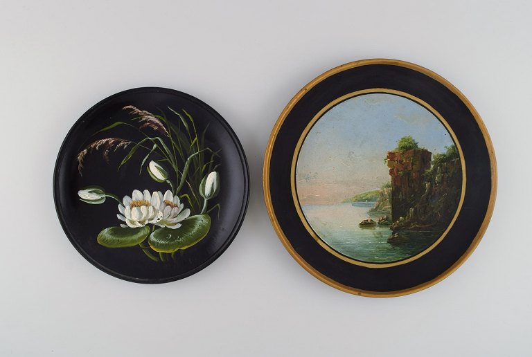 Two antique Hjorth decorative plates in hand-painted teracotta. Late 19th century.
