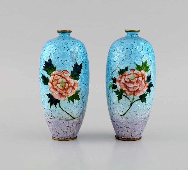 Presumably Limoges. A pair of bronze vases with beautiful enamel work with flowers. 1930s / 40s.