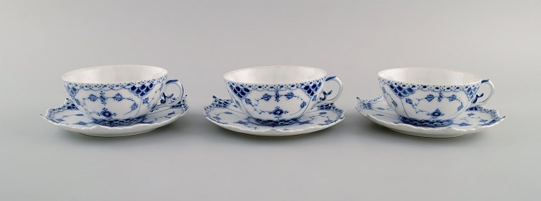 Three antique Royal Copenhagen Blue Fluted Full Lace teacups with saucers. Model number 1/1130. Early 20th century.