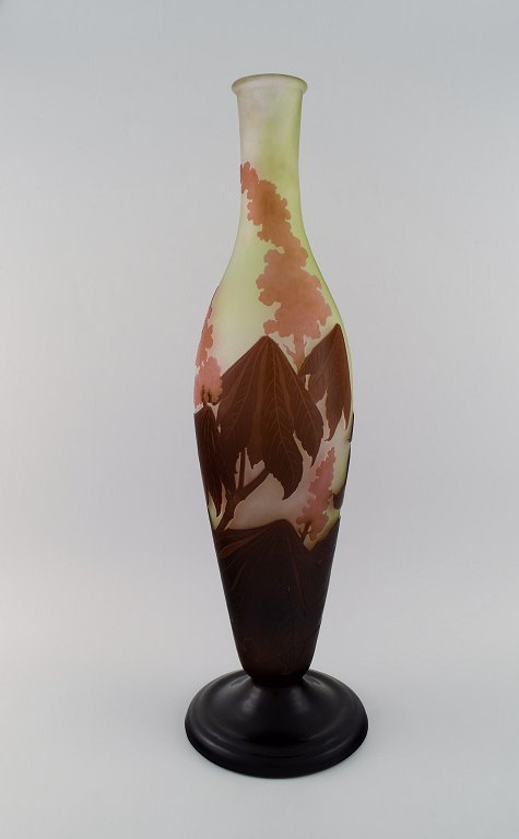 Colossal antique Emile Gallé "Ricin" vase in frosted art glass with light brown and delicate pink carvings in the form of flowers and foliage. Rare model. Early 20th century.