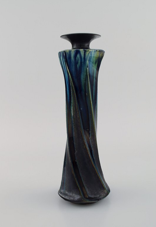 European studio ceramicist. Unique vase in glazed stoneware. Turned shape. Beautiful glaze in deep blue-green shades. 1920s / 30s.