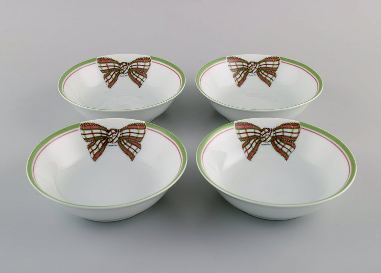 Limoges, France. Four rare Christian Dior "Spring" bowls in porcelain decorated with ribbon and bow. 1980s.
