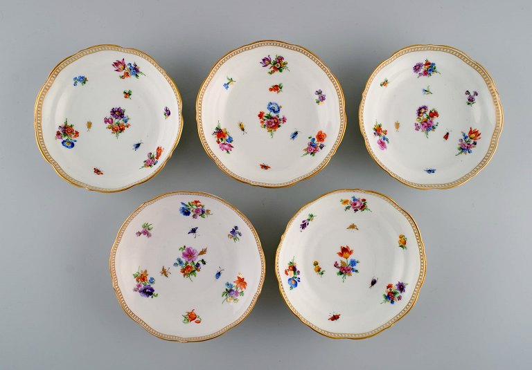 Five small antique Meissen bowls with hand-painted gold decoration, flowers and insects. 1800s.