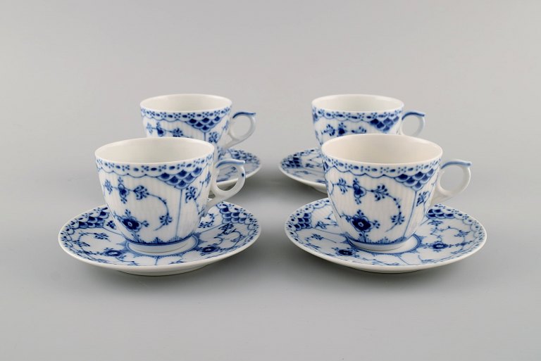 Four Royal Copenhagen Blue Fluted Half Lace coffee cups with saucers. Model number 1/528.