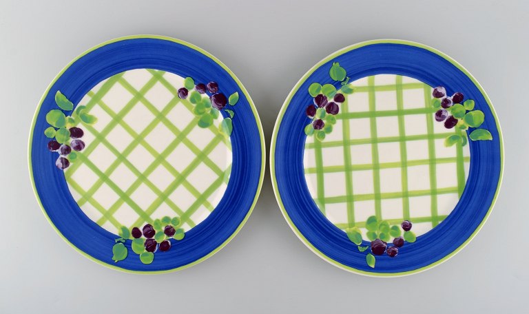 Rosenthal Designers Guild. Orchard Collection. Two large porcelain cover plates. Square design, blue border and grapes. Late 20th century.