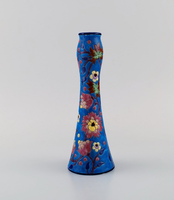 Longwy, France. Art deco vase in glazed stoneware with hand-painted flowers on a blue background. 1920s / 30s.