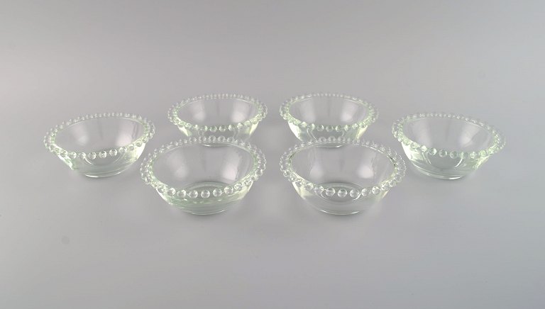 Six finger bowls in clear art glass. France, mid 20th century.