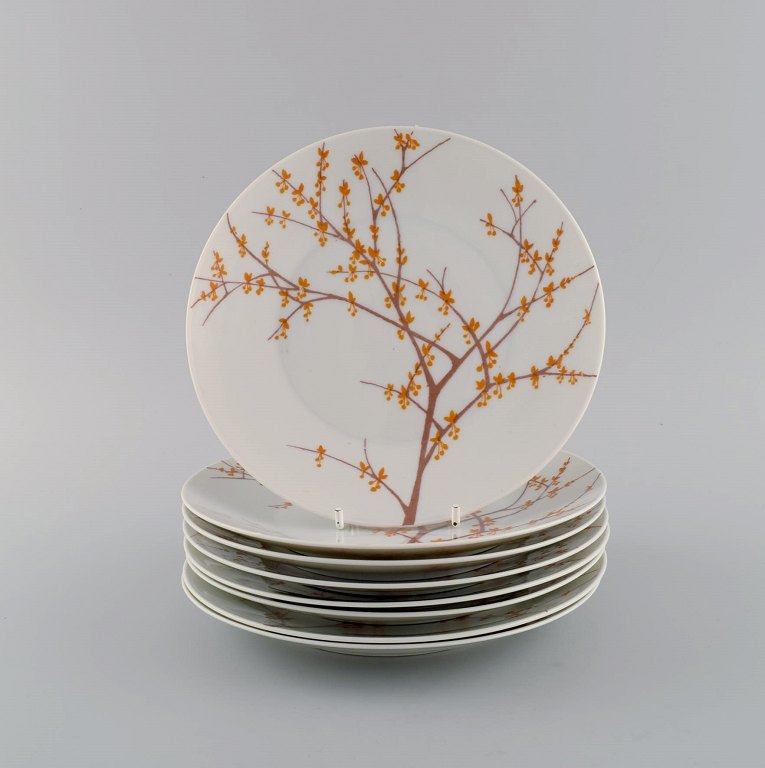 Bjørn Wiinblad for Rosenthal. Otte "Herbst" porcelænstallerkener dekoreret med grene og orange blade. 1970