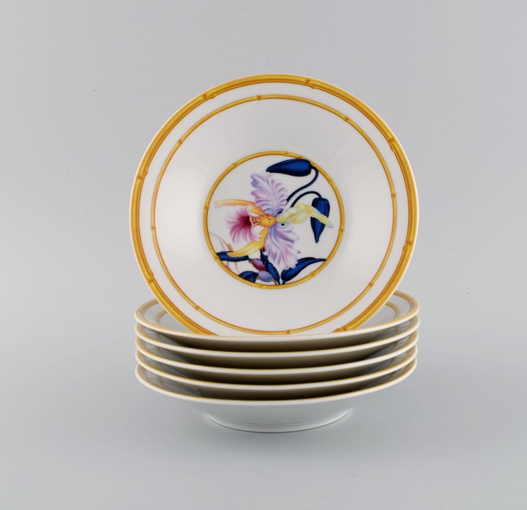 Porcelaine de Paris. "Aurore Tropicale". Six deep porcelain plates decorated with flowers and bamboo. 1980s.