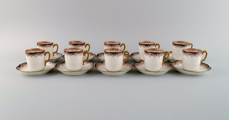 Limoges, France. 10 mocha cups with saucers in hand-painted porcelain. Pink flowers and gold edge. 1930s.