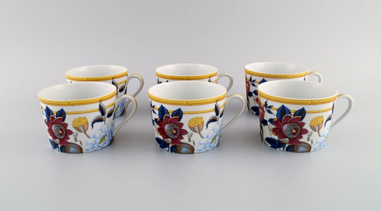 Porcelain of Paris. "Tropical Aurore". Six porcelain coffee cups decorated with flowers, pomegranates and bamboo. 1980s.