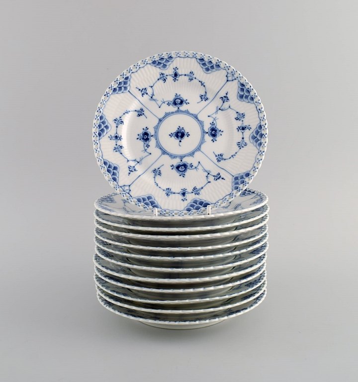 12 Royal Copenhagen Blue Fluted Full Lace Plates. Model number 1/1087. Mid 20th century.