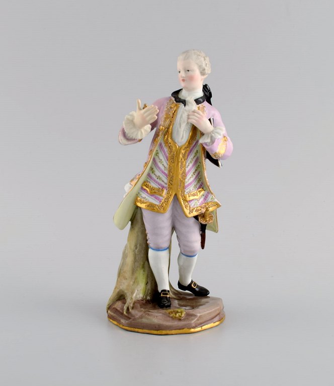 Antik Meissen porcelænsfigur. Nobel herre med guldur. Sent 1800-tallet.