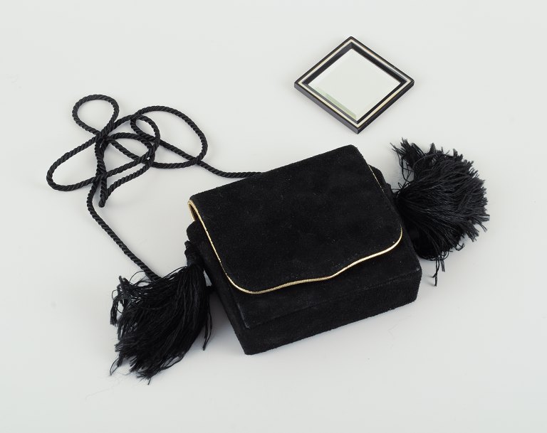 Yves Saint Laurent shoulder bag in suede with fringes and matching make-up mirror.