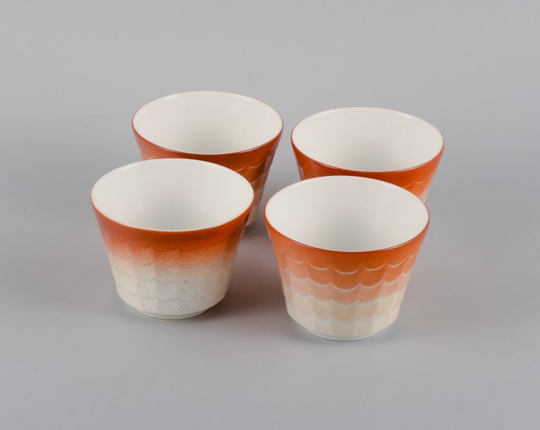 Wilhelm Kåge for Gustavsberg. Four flower pot covers in porcelain. Swedish design, 1960s.