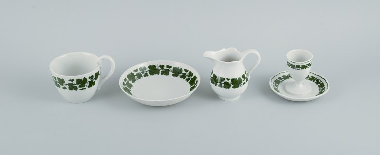 Meissen. Green Ivy Vine. Four parts consisting of egg cup, cup, saucer and cream jug.