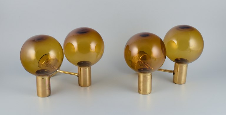 Hans Agne Jakobsson, Sweden, a pair of double wall sconces in brass and smoked glass.