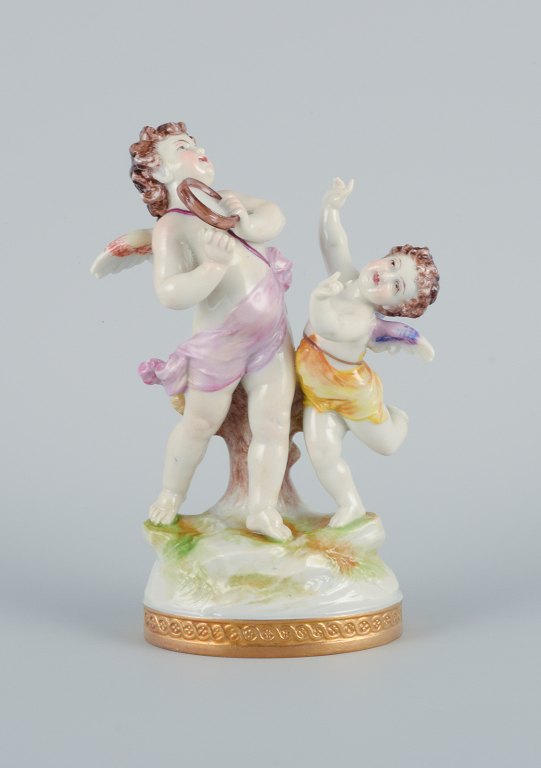Rudolstadt Volkstedt, Germany, porcelain figure with two putti in play.Signed.