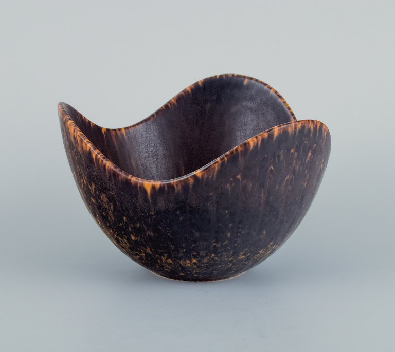 Gunnar Nylund (1904–1997) for Rörstrand. Ceramic bowl, organic shape with dark brown and orange glaze.