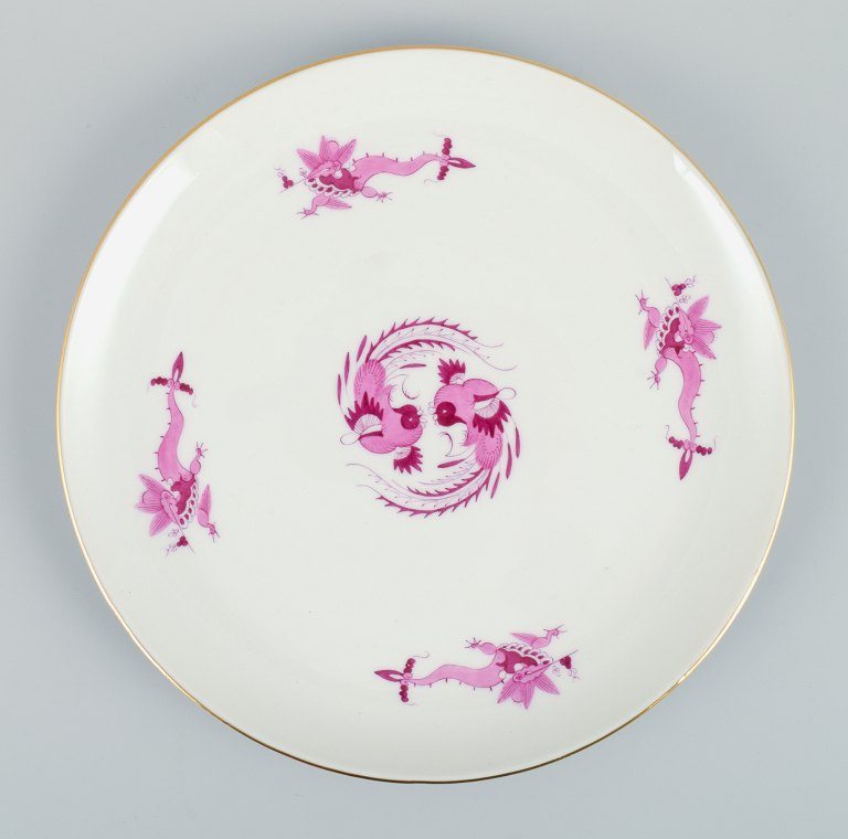Meissen, Germany, Rich Court Dragon, round dish in purple with gold decoration. Hand painted.
