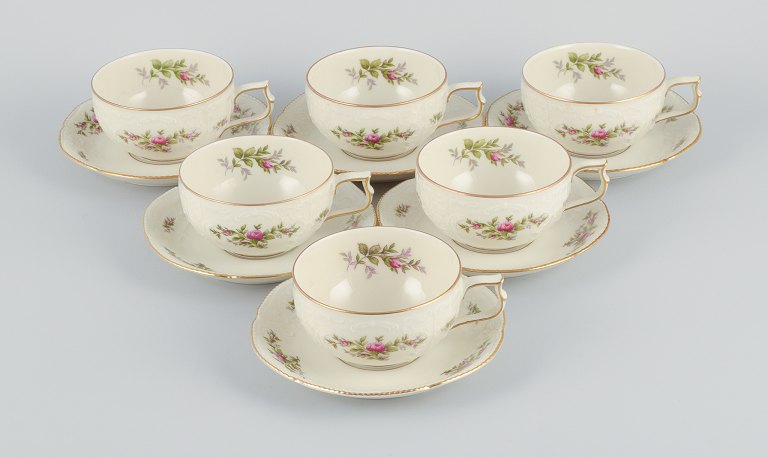 Rosenthal, Germany. "Sanssouci", six cream colored teacups with  saucers decorated with flowers and gold.