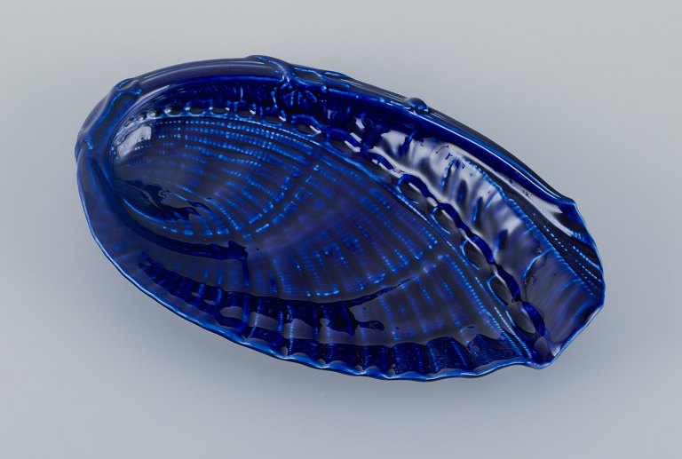 Wilhelm Kåge for Gustavsberg, Sweden, large snail-shaped ceramic bowl in dark blue.