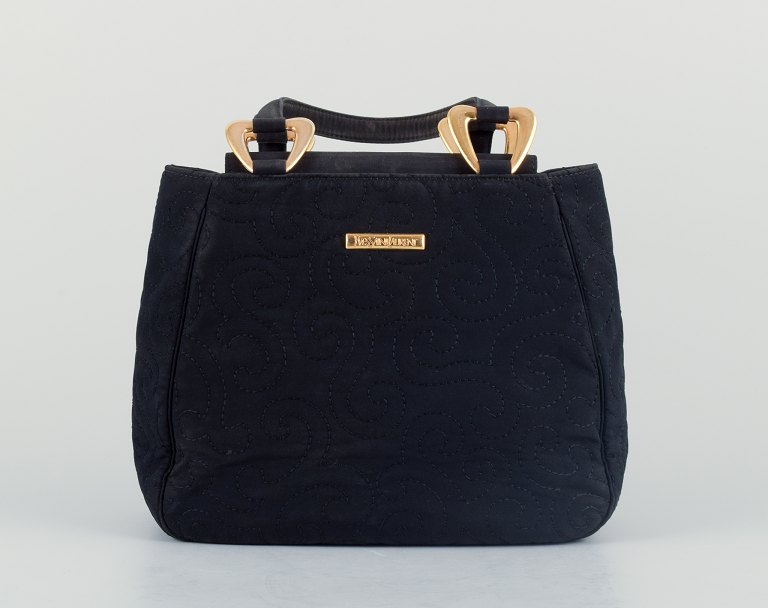 Yves Saint Laurent, small evening bag in black hand-embroidered fabric.Interior with a small compartment.