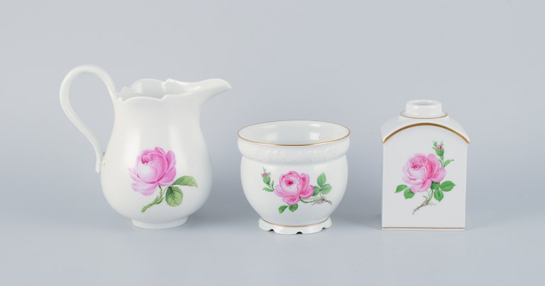 Meissen, three pieces of "Pink Rose" a plant pot, milk jug, and a tea caddy in porcelain hand-painted with pink roses.