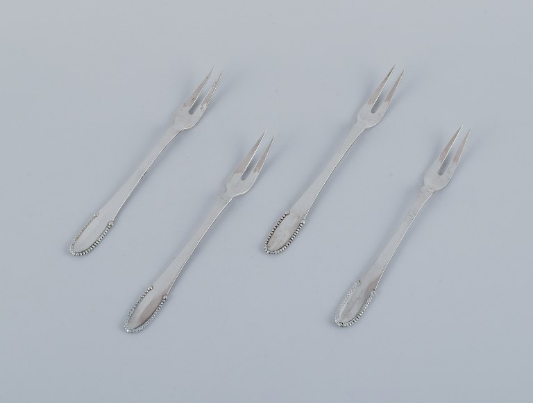 Georg Jensen Beaded.Four cold meat forks in 830 silver.