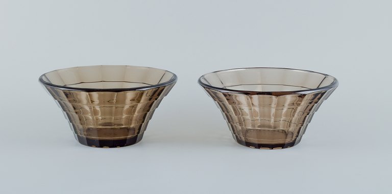 Simon Gate (1883-1945) for Orrefors/Sandvik, Sweden.Two Art Deco bowls in smoked coloured pressed glass.