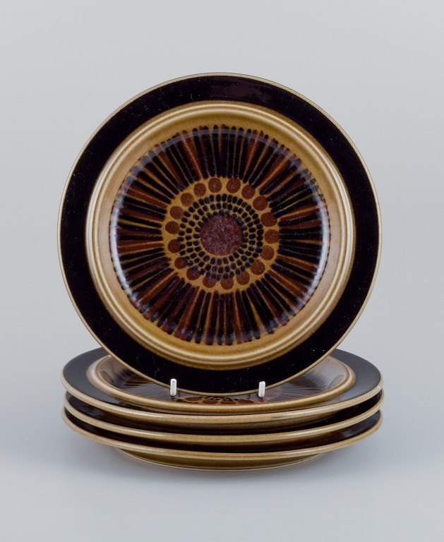 Gunvor Olin-Grönqvist for Arabia, "Cosmos", a set of four lunch plates in stoneware. Retro-style stoneware with green-brown glaze.