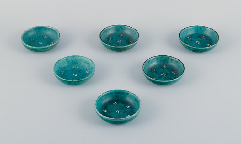 Wilhelm Kåge for Gustavsberg, a set of six "Argenta" ceramic bowls. Glaze in green tones with silver inlays in the shape of leaves.