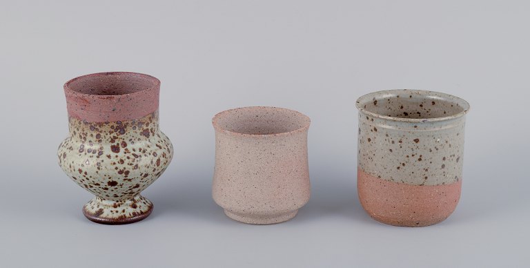 Mogens Nielsen, Nysted / Stouby Keramik, and others.Three pieces of handmade ceramic in shades of brown.