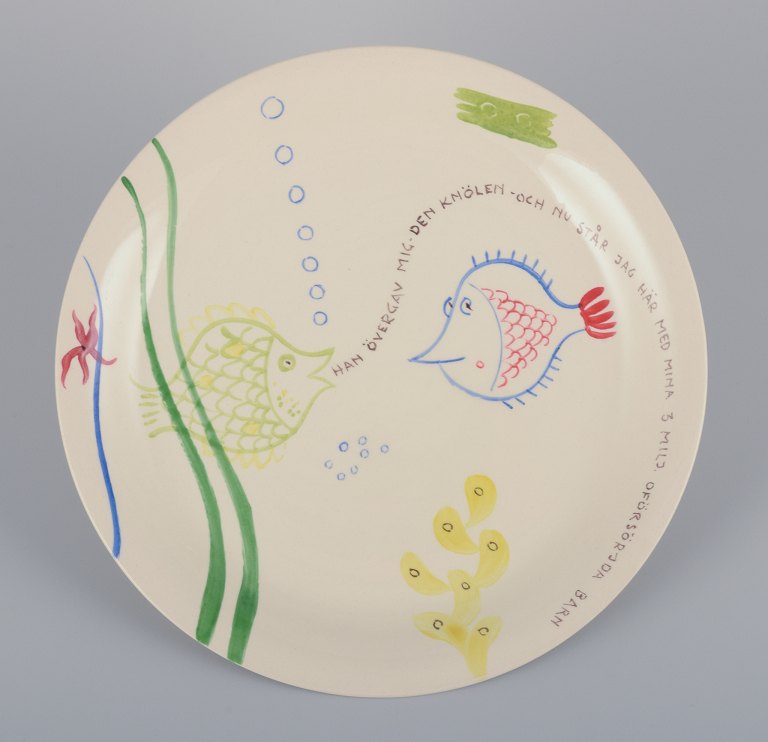Stig Lindberg for Gustavsberg. "Löja" plate. Hand-painted with a fish motif. Satirical illustration with Swedish text.