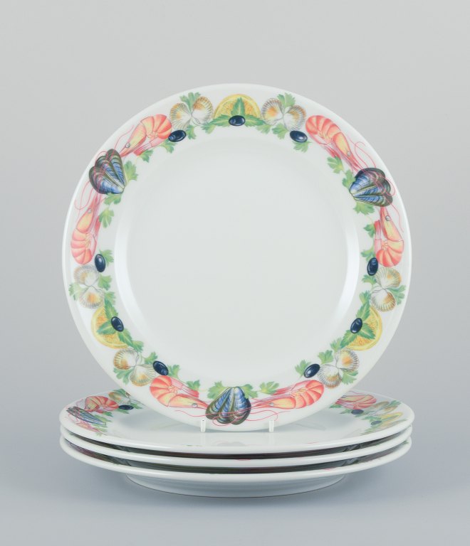 Pillivuyt, France, a set of four large dinner plates in porcelain with seafood motif.