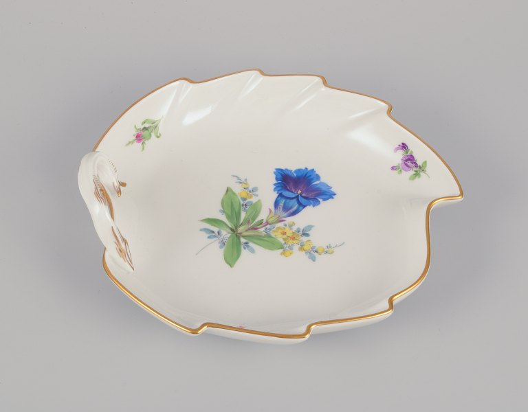 Meissen, Germany. Leaf-shaped porcelain dish. Hand-painted with polychrome flower motifs.