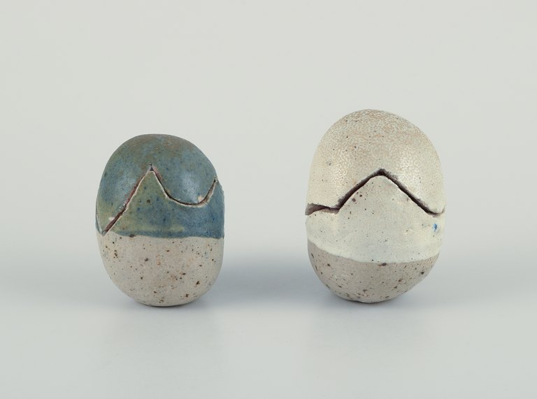 Danish studio ceramicist.Two egg-shaped unique ceramic sculptures. Divided into two parts.