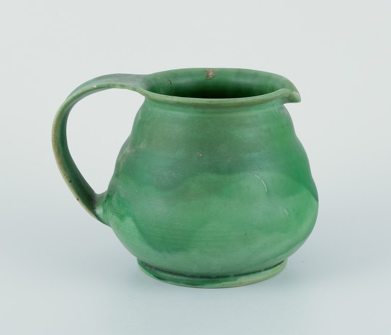 Kähler, Denmark. Ceramic pitcher.Glaze in green tones.