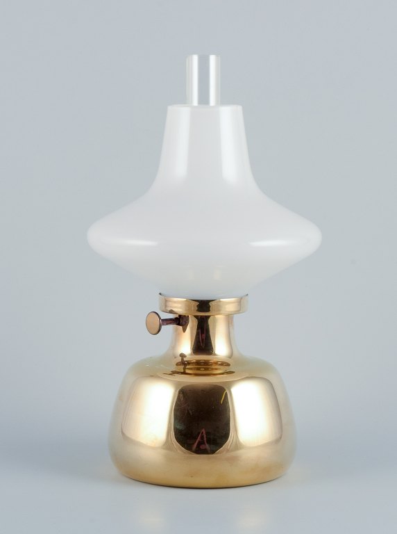 Henning Koppel for Louis Poulsen. Petronella oil lamp in brass with an opal glass shade.