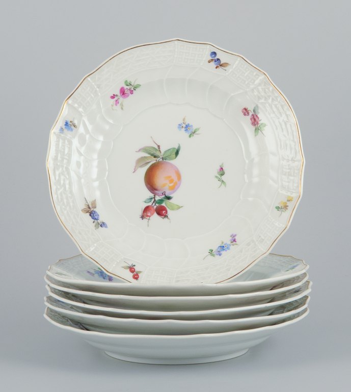 Meissen, Germany. A set of six antique deep porcelain dinner plates. Hand-painted with polychrome fruit motifs.