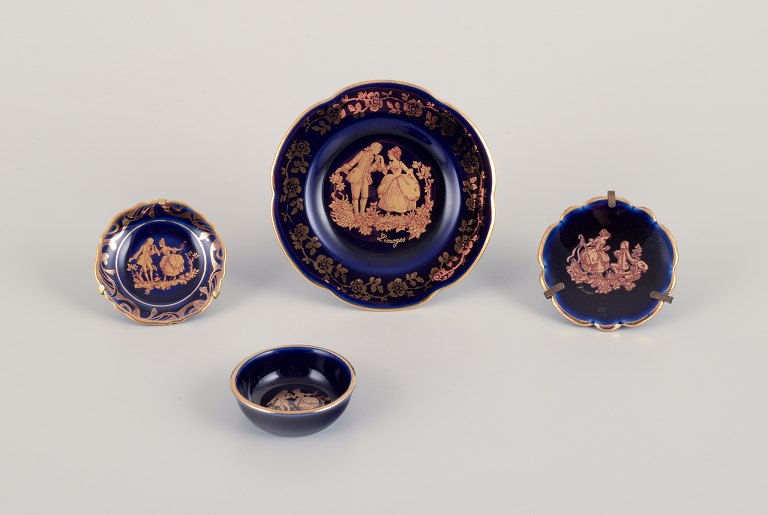 Limoges, France. Four pieces of miniature porcelain decorated with 22-karat gold leaf and beautiful royal blue glaze.
