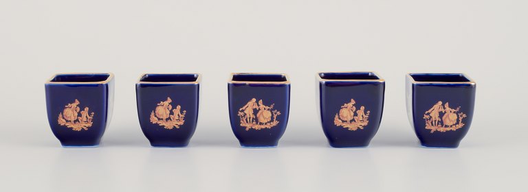 Limoges, France. Five miniature porcelain vases decorated with 22-karat gold leaf and beautiful royal blue glaze. Scène galante.
