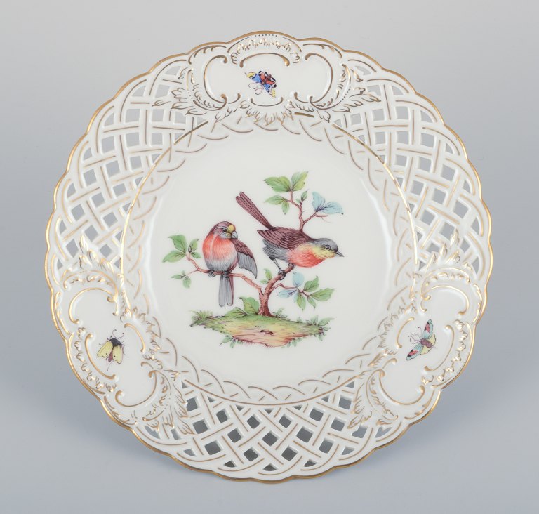 Meissen, Germany. Open lace porcelain plate. Hand-painted with a bird motif and insects, gold trim.