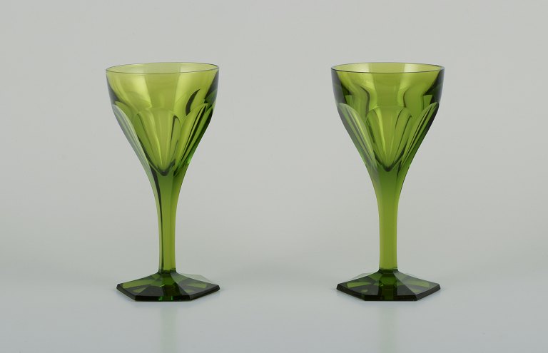 Baccarat, France. Two Tallyrand green white wine glasses in faceted crystal 
glass.