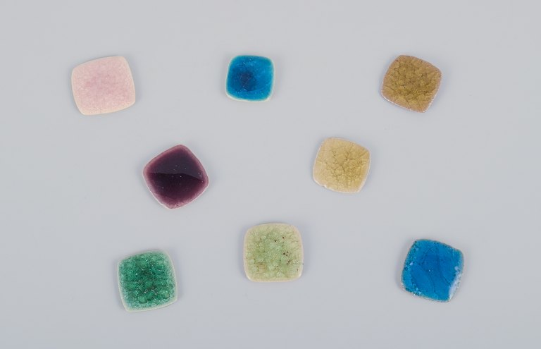 Ole Bjørn Krüger (1922-2007), Danish sculptor and ceramicist.Eight unique brooches in glazed stoneware in various shades.