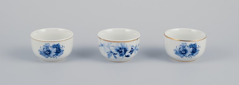 Meissen, Germany. Three small bowls. Hand-decorated with blue floral motifs, gold rim.