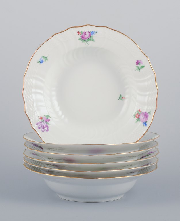 Royal Copenhagen Saxon Flower. Six deep plates in porcelain. Hand-painted with polychrome flowers. Gold rim.
