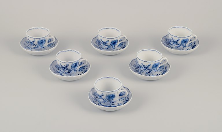 Meissen, Germany.A set of six Blue Onion pattern demitasse cups with saucers.