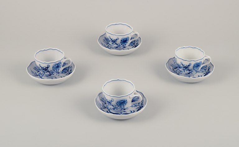Meissen, Germany.A set of four Blue Onion pattern demitasse cups with saucers.